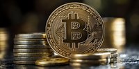 Golden bitcoin cryptocurrency coin with stack of coins on dark background, digital money concept showing wealth and financial technology innovation.