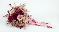 Wedding bouquet with burgundy and blush roses, eucalyptus, and flowing ribbons on white background for bridal photography and romantic celebrations.