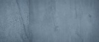 Gray concrete wall texture with natural cracks and weathered surface for industrial design backgrounds and architectural projects.