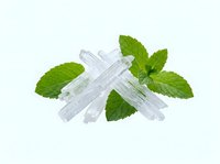 Crushed ice cubes with fresh mint leaves isolated on white background, suitable for beverage design, packaging, and culinary graphics.