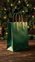 Green and gold gift bag on wooden surface with festive evergreen garland, pinecones and warm lights in background for holiday shopping and seasonal retail displays.