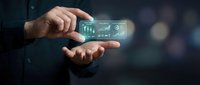 Businessman hands holding holographic financial data charts and graphs floating above palm for business analytics and market research presentation.