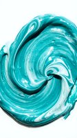 Turquoise and white swirled paint texture with glossy finish, creating abstract fluid art pattern for design, cosmetics, beauty, and creative projects.