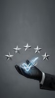 Business hand presenting five silver stars with glowing checkmark for customer satisfaction rating and quality service evaluation concept.