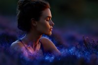 Young woman with closed eyes in profile against purple lavender field at dusk, dreamy atmosphere with magical sparkles and bokeh effects creating ethereal mood.
