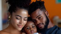 Happy African American family portrait with parents and baby child smiling together in warm indoor setting. Loving mother father and infant bonding moment.