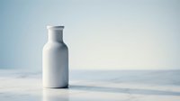 White ceramic milk bottle on clean marble surface with soft blue gradient background for modern kitchen and dairy product concepts.