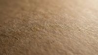 Close-up macro view of human skin texture showing natural pores and fine details in warm lighting for medical, beauty and skincare applications.