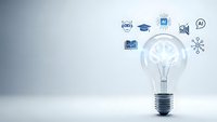 Light bulb with AI and technology icons representing artificial intelligence innovation and digital transformation in education and business.