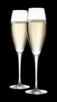 Two champagne flutes filled with sparkling wine, isolated on transparent background. Ready for celebration designs, invitations, print-on-demand products, and event graphics.