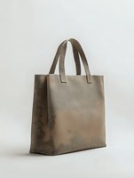 Brown leather tote bag isolated on white background for fashion accessories and shopping concepts.