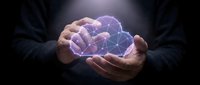 Businessman hands holding glowing digital brain with network connections representing artificial intelligence and machine learning technology concepts.