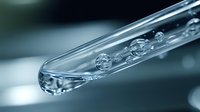 Macro shot of glass pipette with liquid drops and bubbles against blurred teal background, demonstrating scientific precision in laboratory research and medical testing.