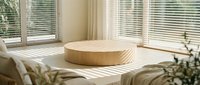 Wooden round podium on white table in bright Scandinavian interior with sunlight through blinds, minimal decor for product display.