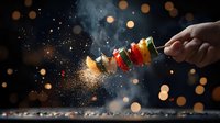Grilled vegetable kebab with spices flying in air against dark background with bokeh lights and steam, dramatic food photography with motion capture.