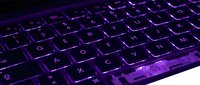 Illuminated gaming keyboard with purple backlit keys on white background, isolated for tech product design and digital marketing use.