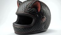 Black leather motorcycle helmet with quilted diamond pattern and cat ear design features red stitching and interior padding on white background, isolated for design use.