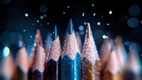 Macro shot of colorful pencil tips with glitter sparkles and bokeh effect on dark background, creative art supplies composition for design and education concepts.