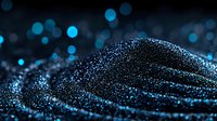 Glowing blue particles forming abstract waves on dark background with bokeh effect, creating futuristic digital landscape for technology concepts.