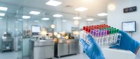 Young scientist or laboratory technician wearing blue gloves holding test tubes with red, purple, and green samples in modern medical or research facility for healthcare and scientific studies.
