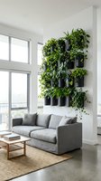 Modern living room with gray upholstered sofa, wooden coffee table, and vertical wall garden of trailing plants in black hanging planters above seating area.