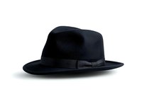 Classic black fedora hat with grosgrain ribbon band on white background, isolated menswear accessory for fashion and style designs.
