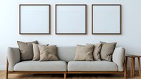 Modern living room interior with light gray sofa, beige cushions and three empty square frames on white wall, wooden side table, minimalist design style.