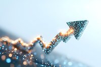 Glowing upward arrow trend line with sparkly particles and bokeh effects against soft blue background, representing business growth and success in finance markets.