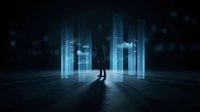 Silhouette of businessman standing in front of glowing digital holographic buildings and data visualization in dark futuristic environment for technology and innovation concepts.