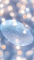 Digital fingerprint scan on soft blue bokeh background with glowing light effects, representing security technology and biometric identification systems.