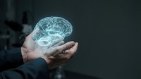 Businessman holding glowing digital brain hologram in cupped hands representing artificial intelligence, innovation, and mental health concepts.