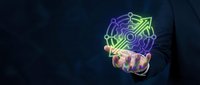 Businessman hand presenting glowing artificial intelligence brain with circuit patterns on dark blue background for technology presentations.