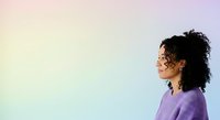 Young woman with curly dark hair and medium skin tone wearing lavender sweater, looking sideways against soft pastel gradient background for portrait and lifestyle use.