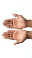 Two open male hands with palms facing up in giving or receiving gesture isolated on white background for design and presentation use.
