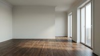 Empty modern room interior with dark hardwood floors and large windows providing natural light for real estate and home design projects.