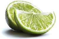 Fresh lime wedges with juicy pulp and bright green peel on white background, macro shot showing detailed texture and natural citrus segments.
