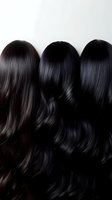 Three different shades of long dark wavy hair showing smooth texture and shine against white background, demonstrating professional hair coloring and styling results.