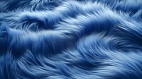 Luxurious blue faux fur texture with soft wavy pattern creates elegant background for fashion, textile and interior design projects. Seamless repeat available.