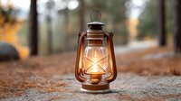 Vintage oil lantern glowing warmly on forest ground during golden hour creating cozy camping atmosphere for outdoor adventures and rustic decor projects.