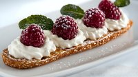 Elegant raspberry tart with fresh cream dollops and mint leaves on golden pastry base, gourmet dessert presentation for bakery menu or culinary photography.