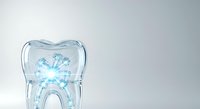 Transparent tooth-shaped glass container with blue dental circuit pattern inside, isolated on white background for dental care, orthodontics, and technology design projects.
