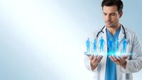 Young male doctor in white coat holding holographic family figures representing healthcare protection and medical insurance coverage for patients.