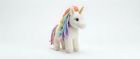 White plush unicorn toy with rainbow mane and tail isolated on white background for children's products, nursery decor and fantasy themed designs.