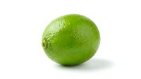 Fresh green lime with textured skin isolated on white background, suitable for food, beverage, nutrition, and culinary design projects.