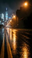 Wet city street at night with glowing streetlights and blurred urban skyline creating atmospheric reflections on rain-soaked asphalt pavement.