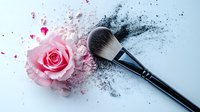 Pink rose and makeup brush with black powder explosion effect on light background, creative cosmetic and beauty concept for social media and advertising.