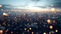 Blurred cityscape with glowing bokeh lights in foreground creating dreamy atmosphere at dusk, modern urban skyline silhouettes against moody evening sky.