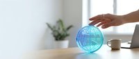 Businesswoman touching glowing globe on desk with laptop and plant, representing global business, international commerce, and worldwide connectivity for corporate and technology concepts.