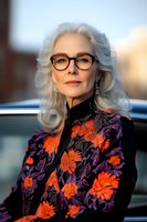 Elegant senior woman with silver hair wearing glasses and floral jacket with orange and purple pattern. Natural beauty portrait showcasing confident mature model outdoors.