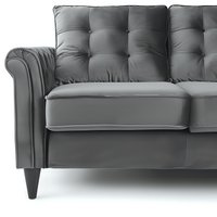 Gray tufted sofa with rolled arms and wooden legs shown in close-up detail view against white background, highlighting luxurious upholstery and classic design elements.